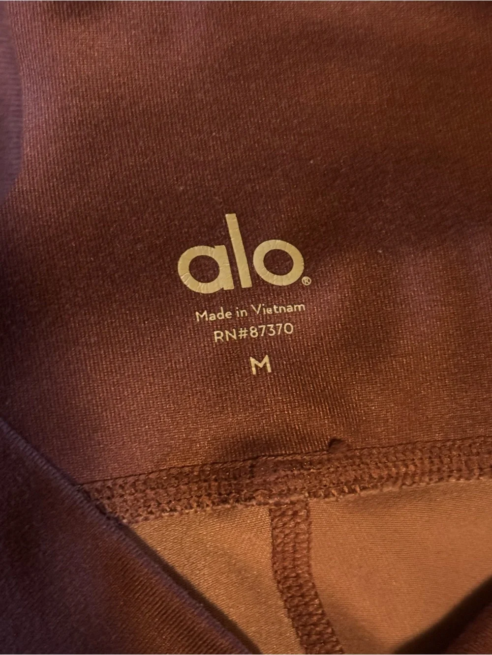 ALO Yoga Mauve Capri Leggings with Black Stripes
